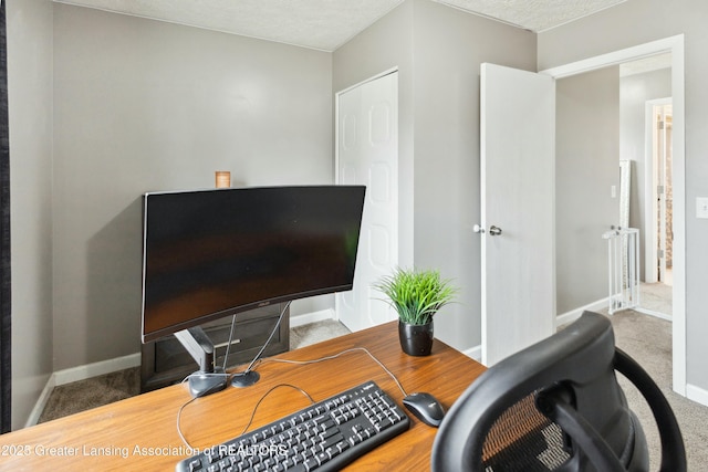 office featuring baseboards and carpet floors