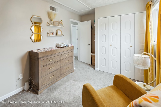 sitting room with visible vents, light carpet, and baseboards