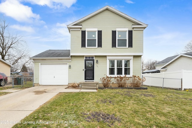 colonial inspired home featuring a front yard, an attached garage, fence, and driveway