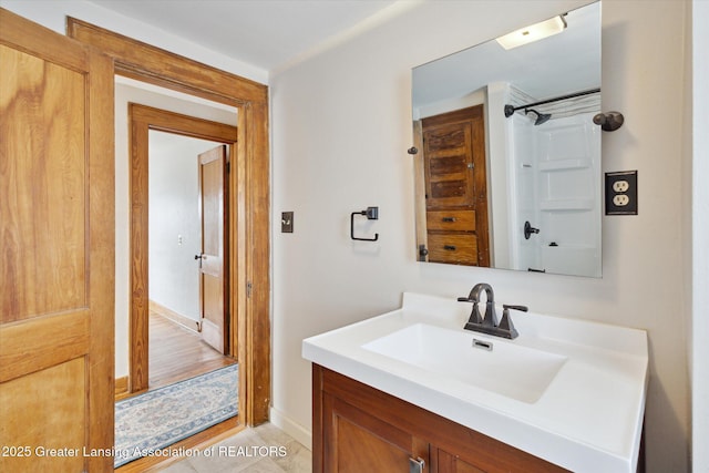 full bathroom with vanity and a shower