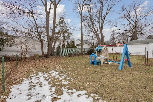 view of yard featuring a fenced backyard and a playground