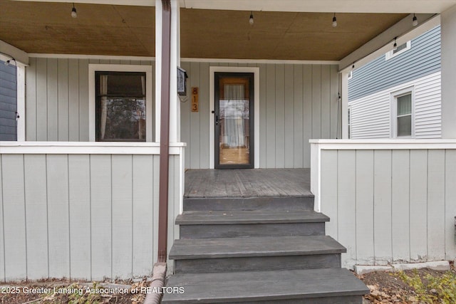 doorway to property featuring covered porch