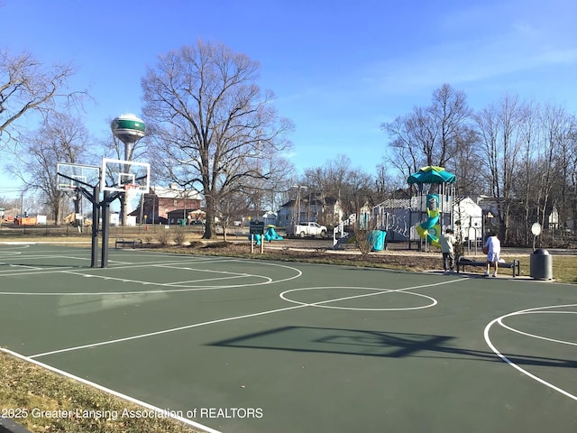 view of sport court featuring playground community and community basketball court