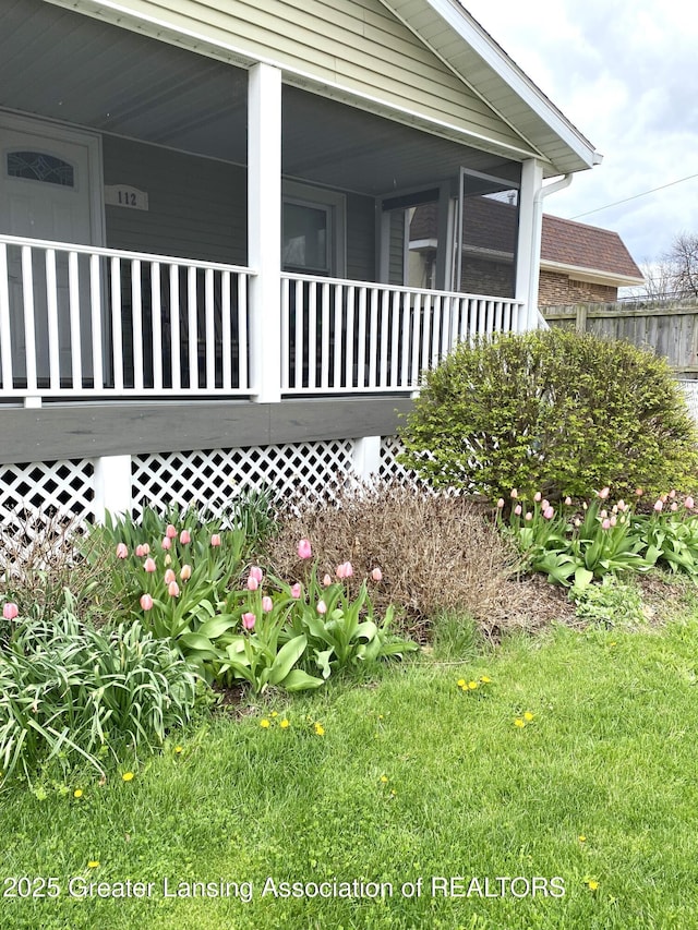 view of side of property with a sunroom