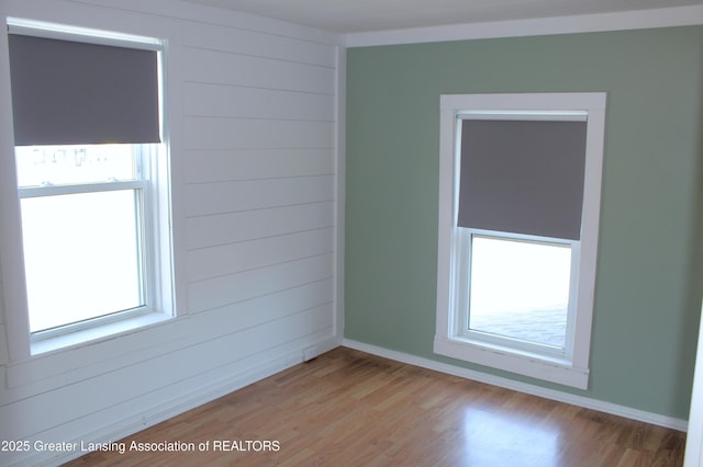 spare room with light wood-style flooring