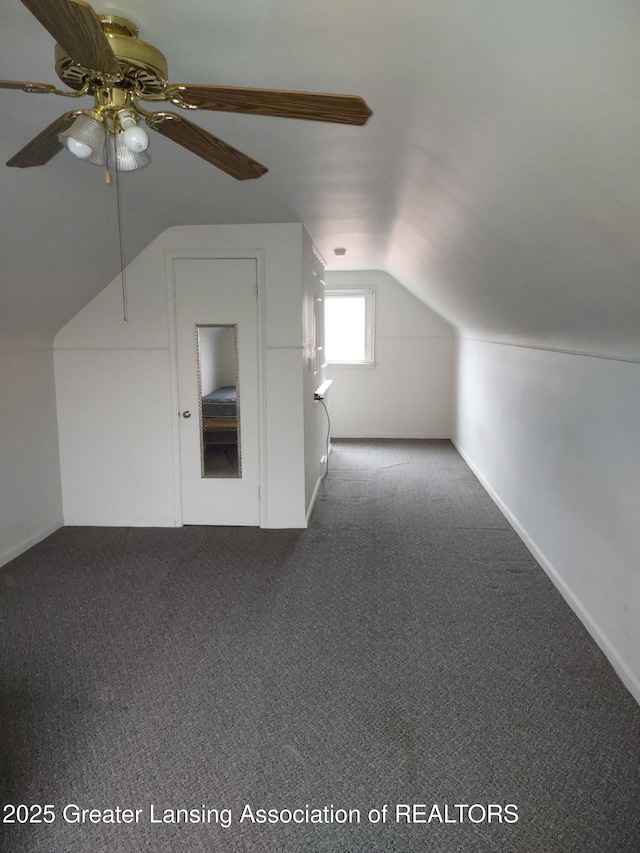 bonus room featuring carpet floors, baseboards, a ceiling fan, and vaulted ceiling