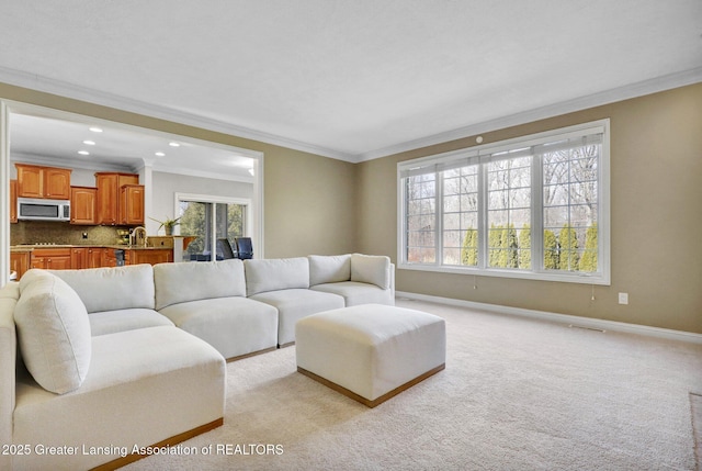 living room with visible vents, light carpet, ornamental molding, recessed lighting, and baseboards