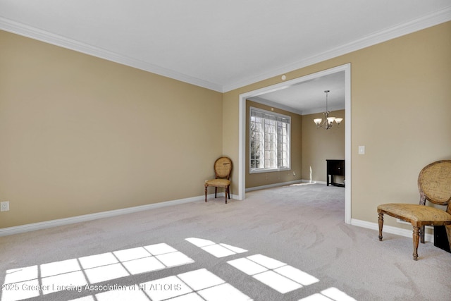 unfurnished room with crown molding, a notable chandelier, carpet, and baseboards