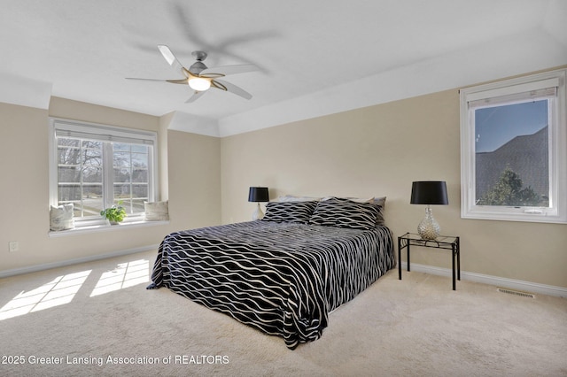 bedroom featuring ceiling fan, carpet, visible vents, and baseboards