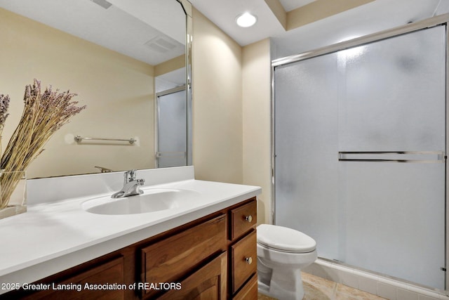 bathroom featuring visible vents, toilet, a stall shower, recessed lighting, and vanity