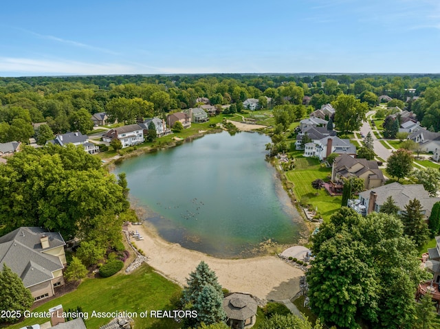 birds eye view of property featuring a residential view and a water view