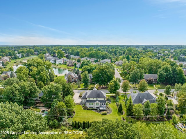 birds eye view of property with a water view