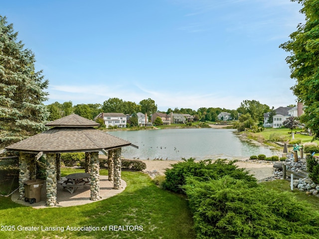 property view of water with a gazebo and a residential view