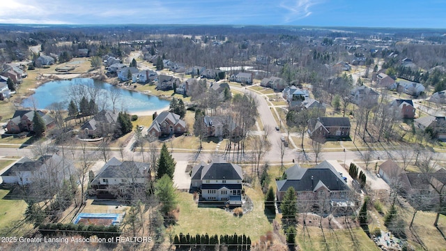 aerial view with a residential view and a water view