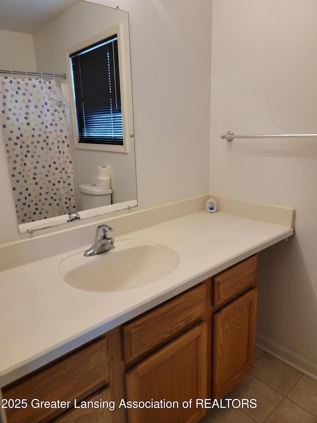 bathroom featuring vanity, tile patterned floors, curtained shower, and toilet