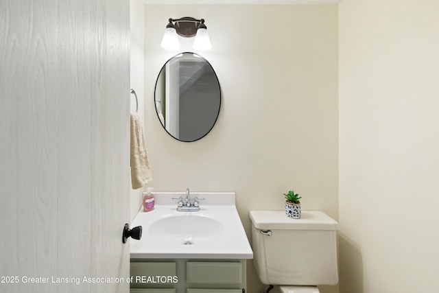 bathroom featuring toilet and vanity