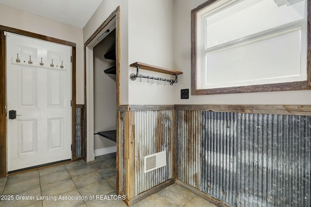 interior space with visible vents and tile patterned flooring