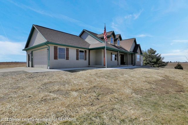 view of front of home with a garage and driveway