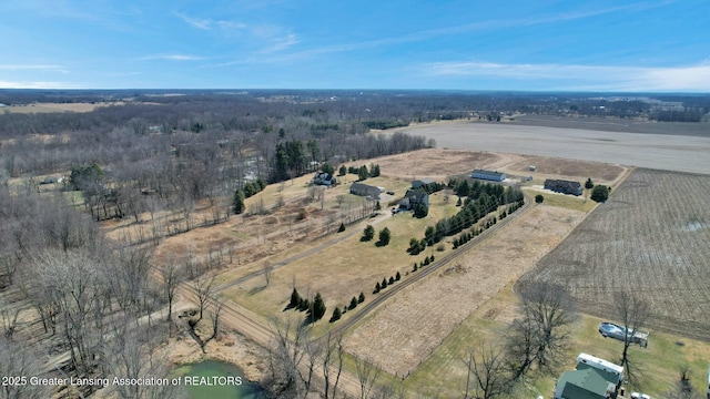 birds eye view of property featuring a rural view