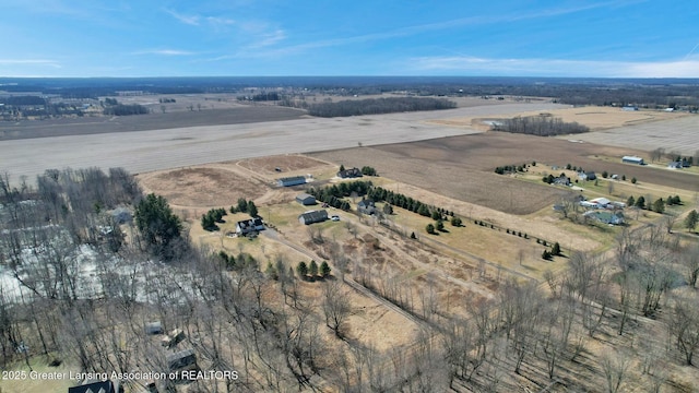 birds eye view of property featuring a rural view