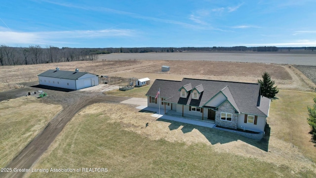 birds eye view of property featuring a rural view