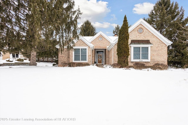 view of front of house featuring brick siding