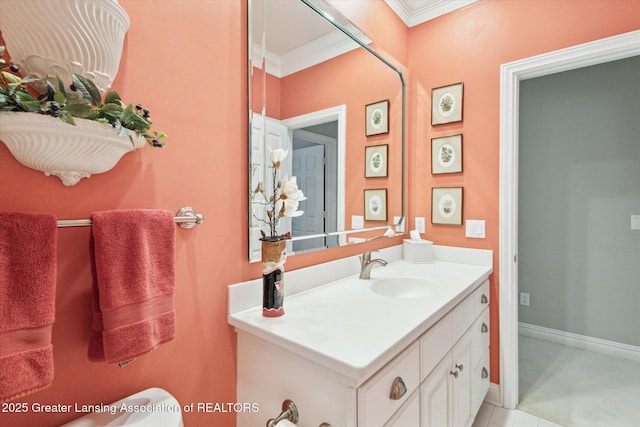 bathroom featuring toilet, vanity, baseboards, and ornamental molding