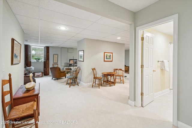 interior space featuring recessed lighting, baseboards, and a drop ceiling