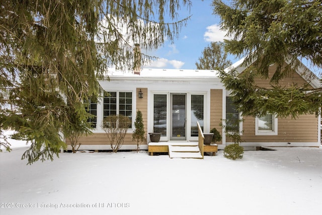 view of snow covered house