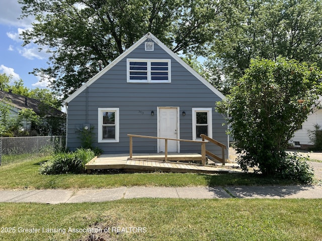 view of front facade featuring a deck and fence