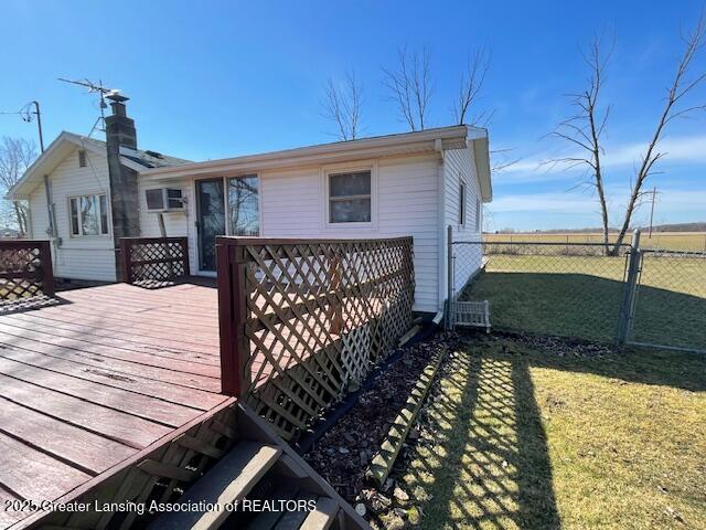 deck featuring a yard and fence