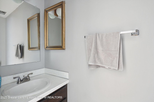 bathroom with visible vents and vanity