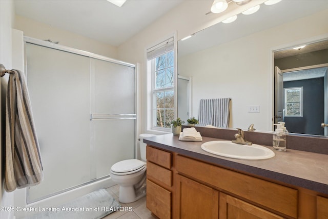 bathroom featuring tile patterned floors, plenty of natural light, and a stall shower