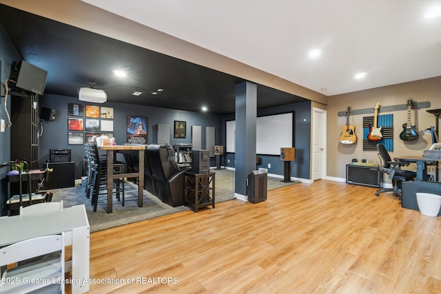 interior space with baseboards and wood finished floors