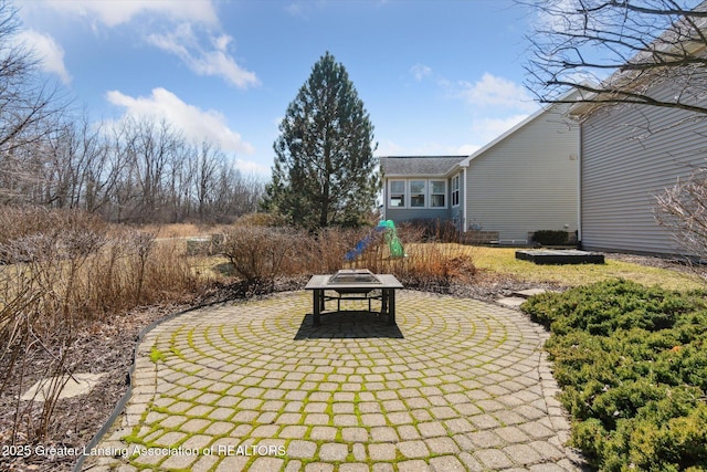 view of property's community featuring a patio