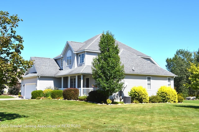 view of side of home featuring a lawn, a porch, an attached garage, and roof with shingles