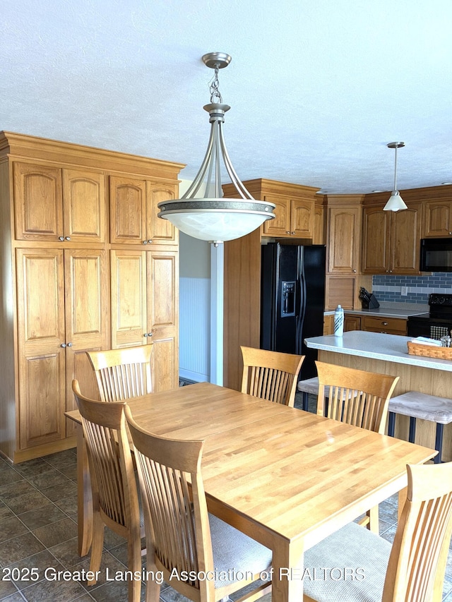 dining area with a textured ceiling