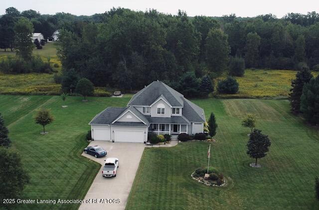 bird's eye view featuring a view of trees