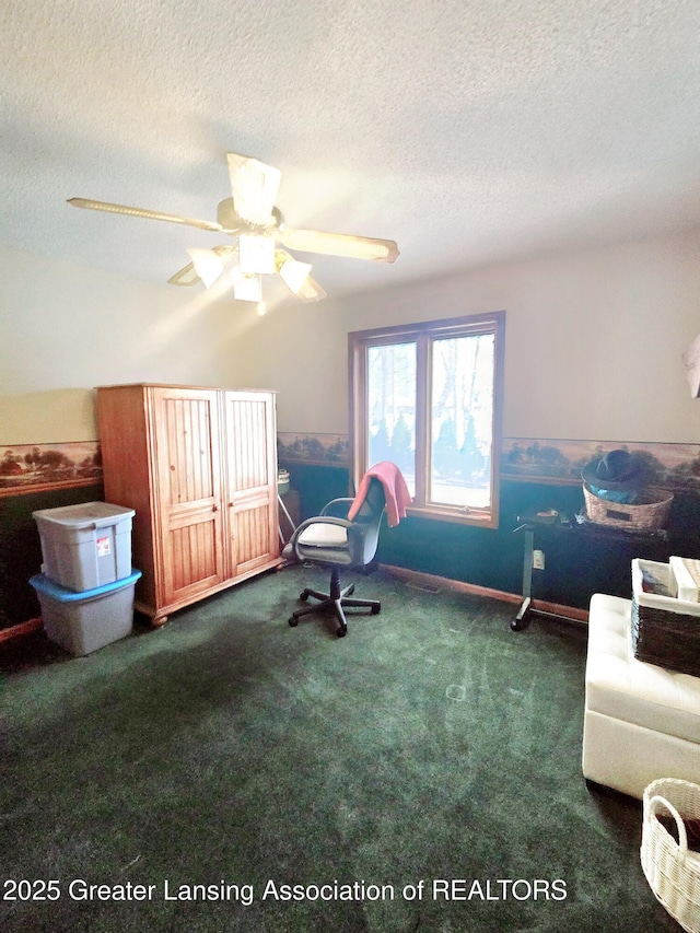 interior space with ceiling fan and a textured ceiling