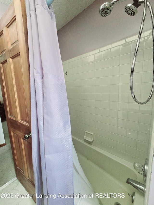 bathroom featuring shower / tub combo with curtain