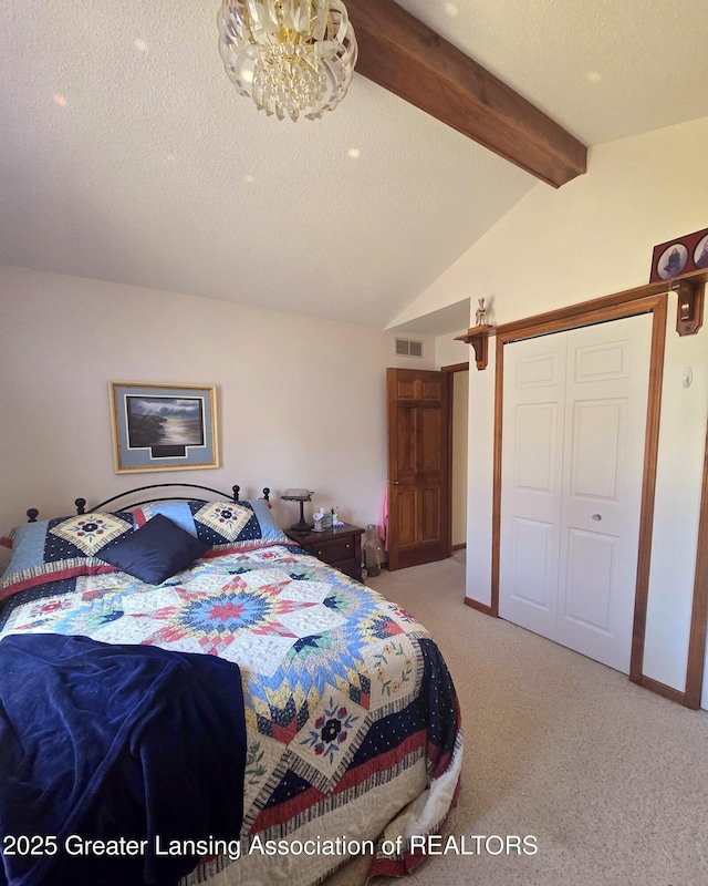 bedroom featuring visible vents, vaulted ceiling with beams, carpet floors, a closet, and a textured ceiling