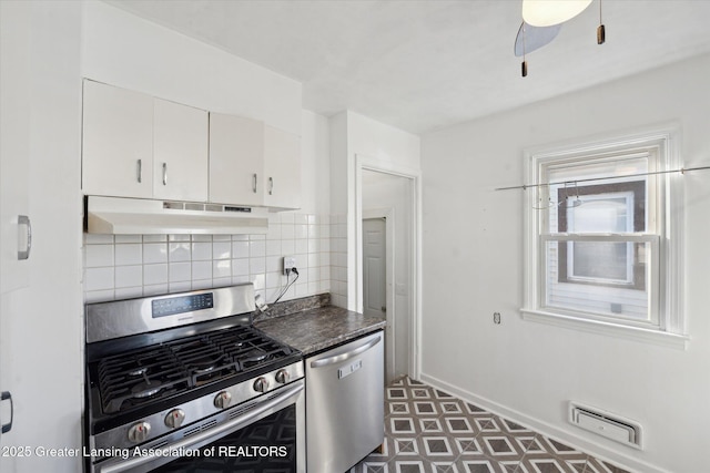 kitchen featuring tasteful backsplash, visible vents, under cabinet range hood, appliances with stainless steel finishes, and white cabinets