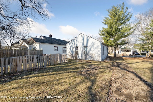 exterior space featuring a yard and fence