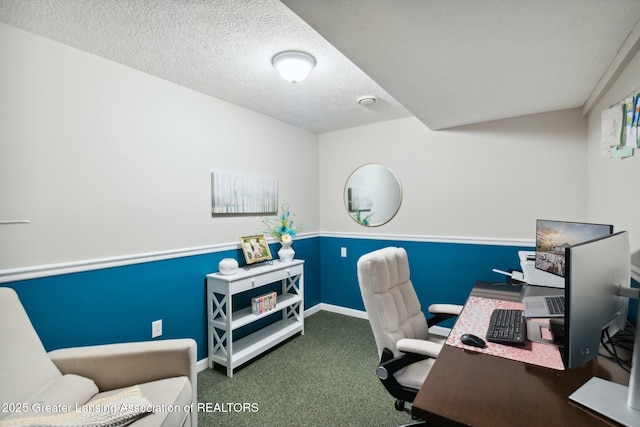 office area featuring carpet flooring, a textured ceiling, and baseboards