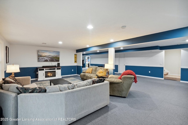 living room with stairway, carpet, baseboards, recessed lighting, and a warm lit fireplace