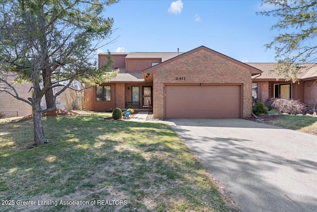 view of front of home featuring brick siding, a front yard, roof with shingles, driveway, and an attached garage