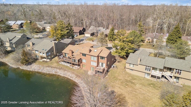 aerial view featuring a view of trees and a residential view