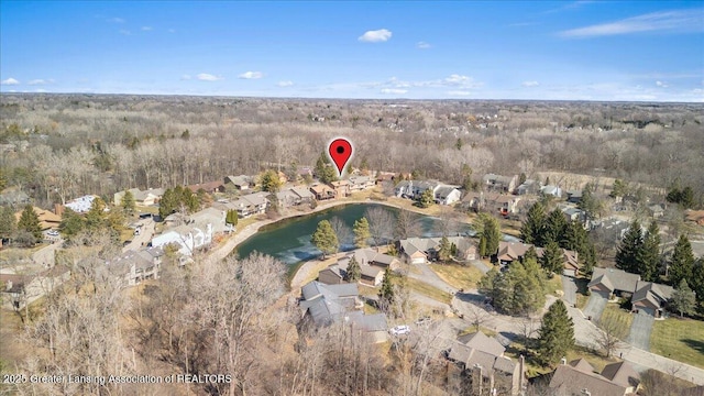 birds eye view of property with a residential view and a water view