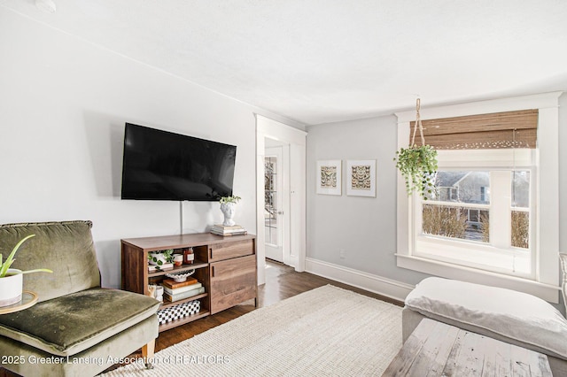 interior space with dark wood-type flooring and baseboards