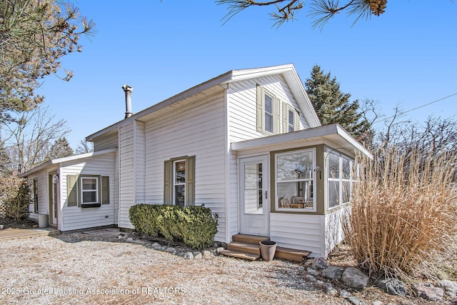 view of front of property featuring a sunroom and entry steps